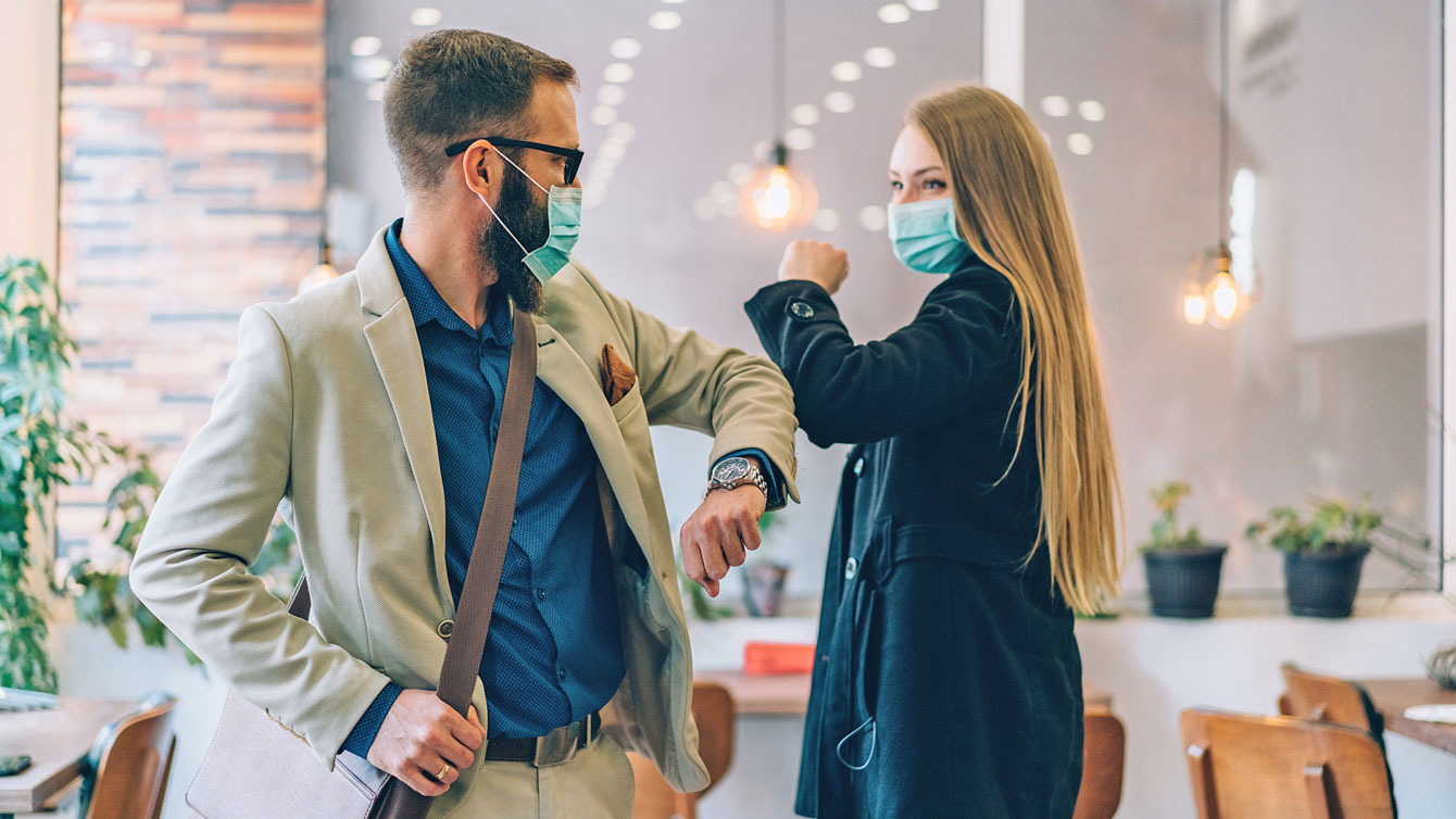 Man and woman with face mask.