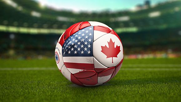 Soccer Football ball with flags of North America countries on the field of football stadium. 
