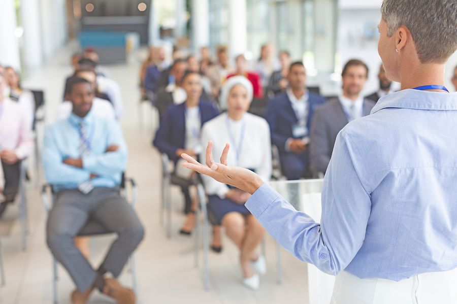 Female speaker speaks in a business seminar