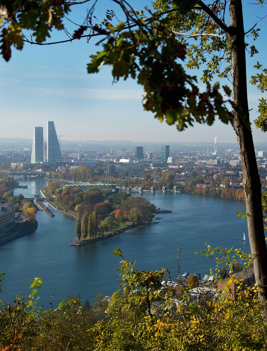 Looking out over the city of Basel from a viewpoint in Grenzach-Wyhlen to the Roche towers—a symbol of the region’s strong pharmaceutical connection and its proximity to Switzerland. | © Raphael Weber/Alamy Stock Photo