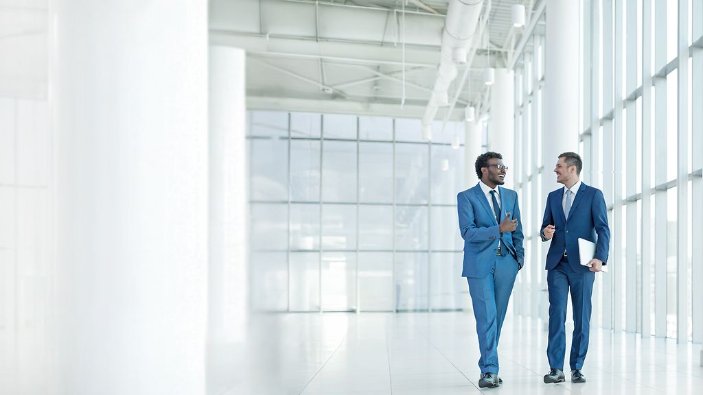 Smiling businessmen in office