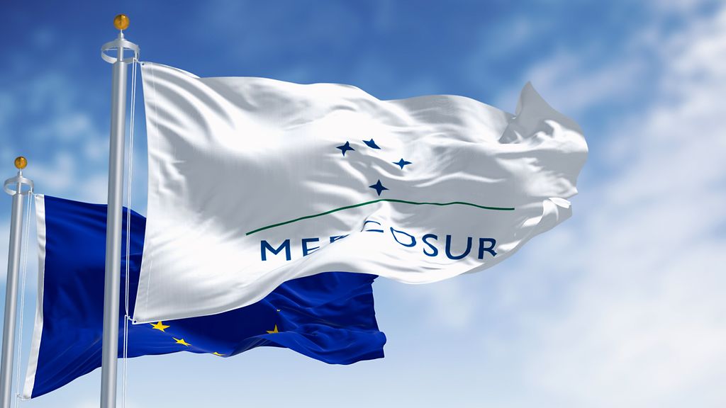 Flags of Mercosur and European Union waving in the wind on a clear day. International trading. Finance and economy. 3d illustration render. Selective focus