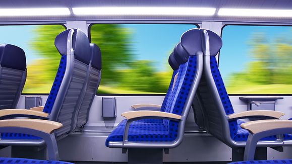 Empty passenger seats inside the regional train