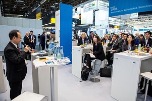 Japanese delegation receives information on the Germany healthcare market by GTAI's Japan representative Hiroshi Iwamura .