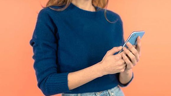 Woman holding mobile phone