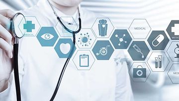 Doctor with a stethoscope in the hands and office background