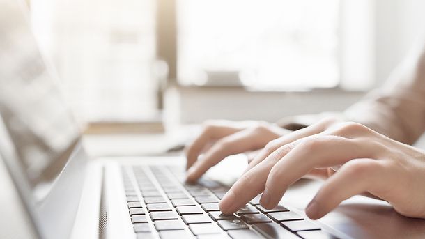 Typing on laptop closeup, searching, Tenders Daily; Internet