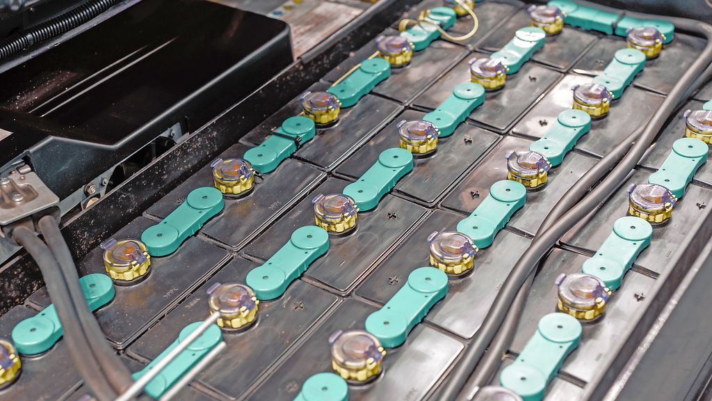 Powerful rechargeable battery forklift. Contacts of electrolytic cans are connected by crosspieces.