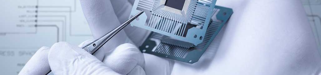Electronic components held in hand in laboratory, close up