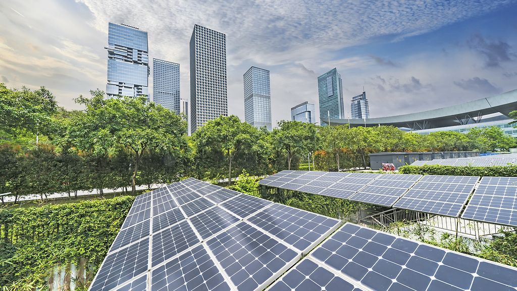 Solar panels with cityscape of modern city, Ecological energy renewable concept.