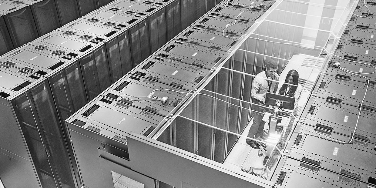 High angle view of technicians working in server room