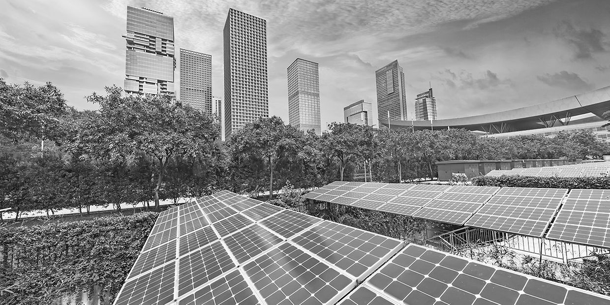 Solar panels with cityscape of modern city